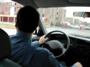 man driving a car for business use