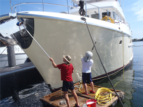 Boat insurance -men cleaning vessel