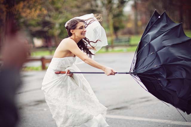 Wedding Insurance 101 - Bride in a windy storm