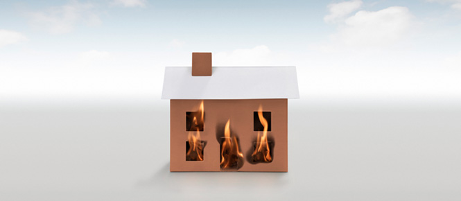 Fire dwelling insurance - Paper house on fire