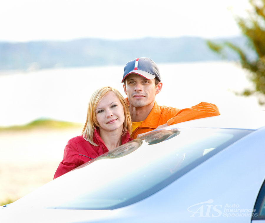 Auto insurance in California- couple leaning on car