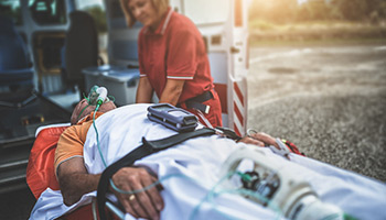 car passenger getting into ambulance - um coverage