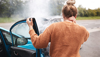 female getting out of passenger vehicle after car accident with an uninsured motorist coverage