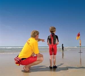 RNLI lifeguard offering safety advice