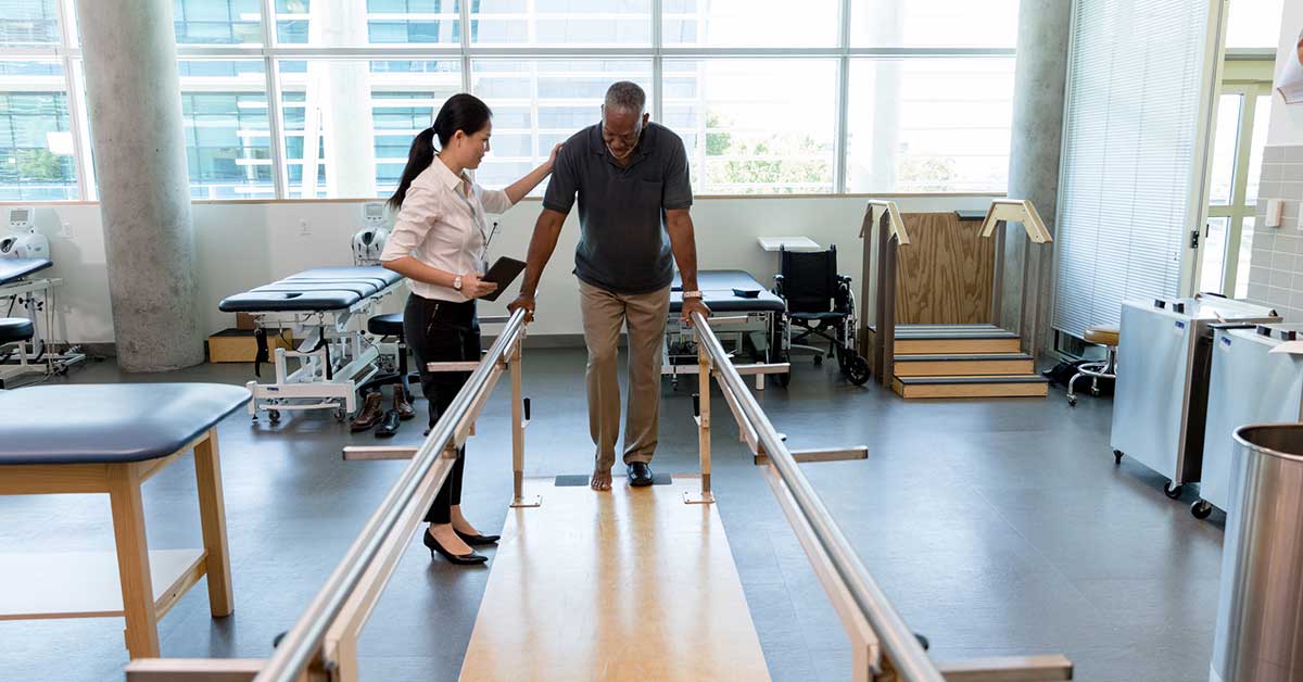 man getting physical therapy through Workers Compensation Insurance