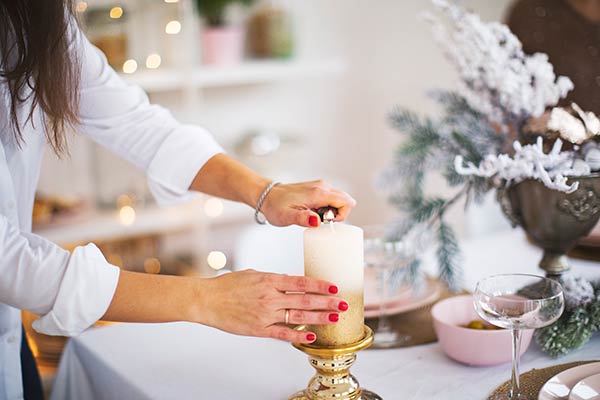 lighting holiday candle