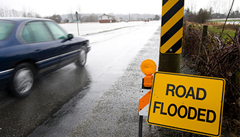 rain - road flooded sign