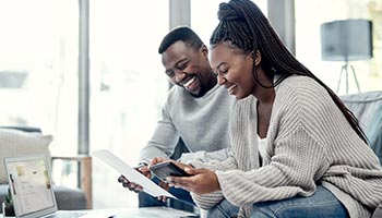 Two people shopping for better auto insurance rate. 