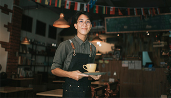tax tips - teenager helping family cafe