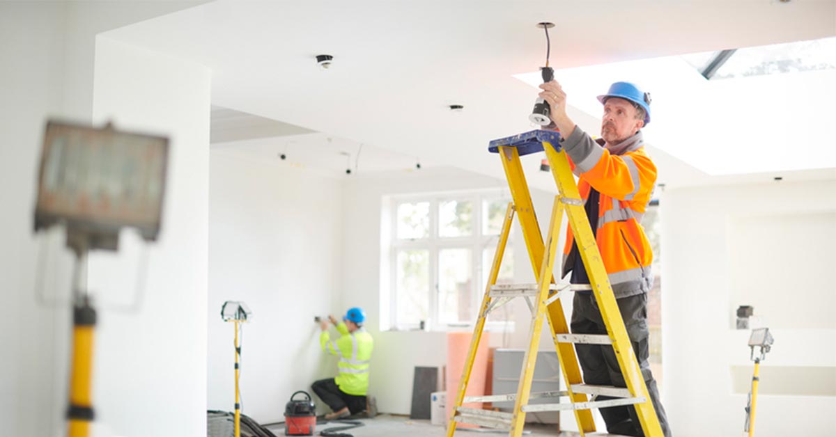 electricians installing light