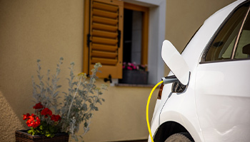 an electric vehicle being charged at home