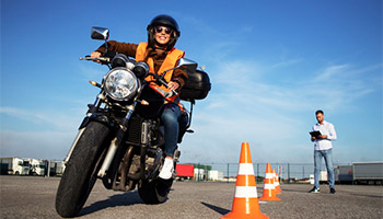 Student learning how to safely ride a motorcycle. 