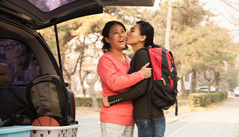 A mother and daughter saying goodbye before student heads to college