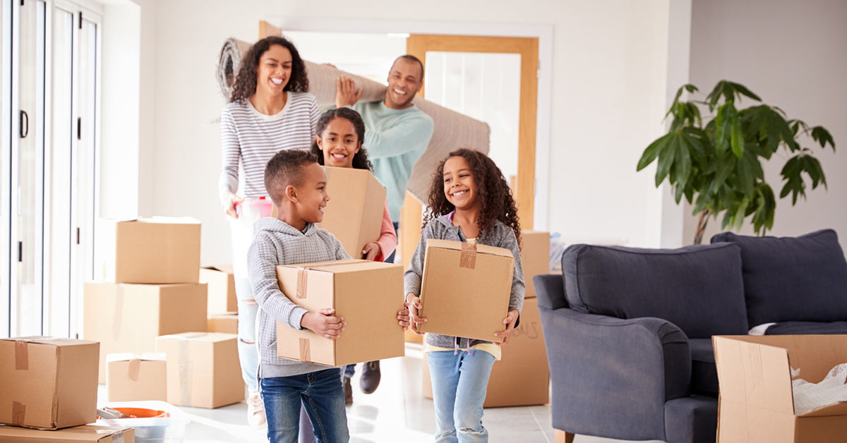 a family moving into a house after buying a home