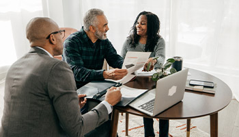 A couple reviewing their escrow options 