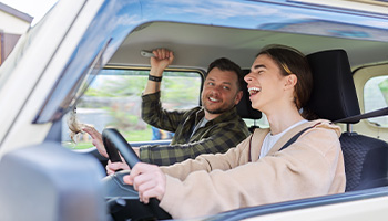 parent driving with their teenager 