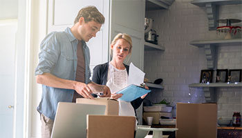 people making an inventory list of their home