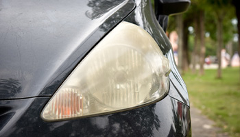 A car with yellow headlights