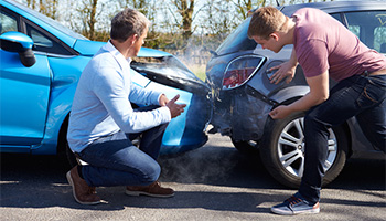 two people reviewing a car accident