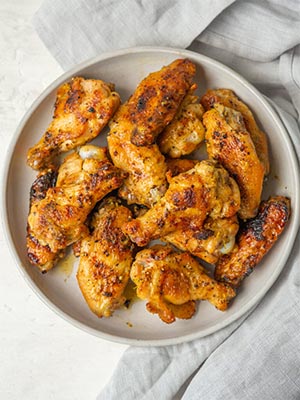 grilled lemon pepper chicken wings on a plate