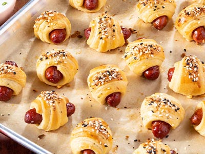 pigs in a blanket on a baking tray