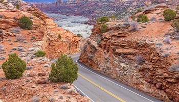 a road through rocky formations in Utah on Scenic Byway 12