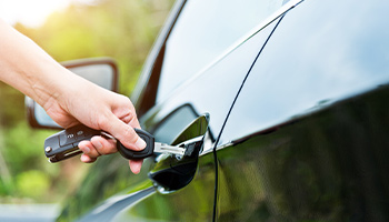 a person opening their car door