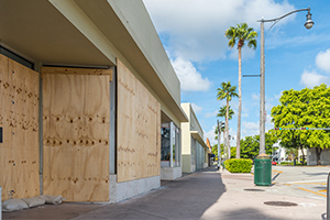 businesses boarding window from hurricane - commercial property insurance