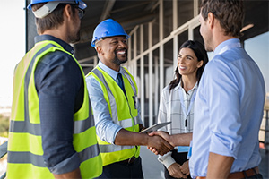 construction worker shaking hands - builder's risk insurance