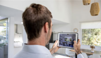 a person using a tablet to crate a digital home inventory list with video