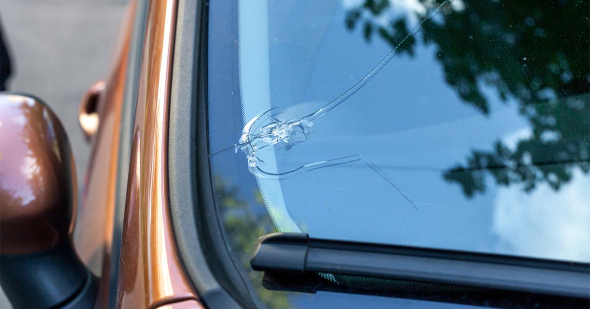 a broken car windshield that needs a replacement