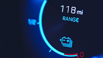 an electric vehicle's dashboard showing the car's range