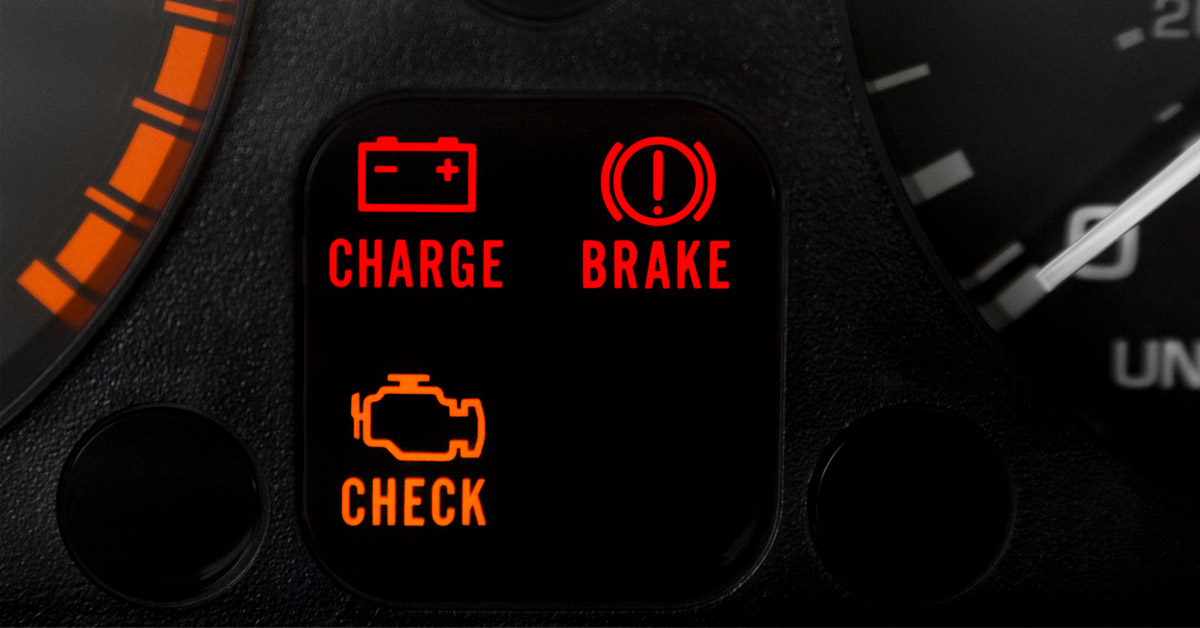 multiple dashboard warning lights illuminated on a vehicle's dashboard