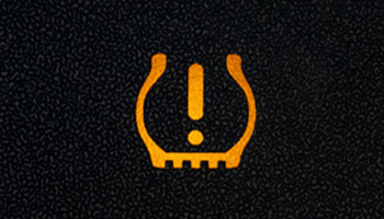 sign indicating the car tires have low pressure