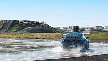 a Porsche making a sharp turn at the Porsche experience, a good car gift idea 