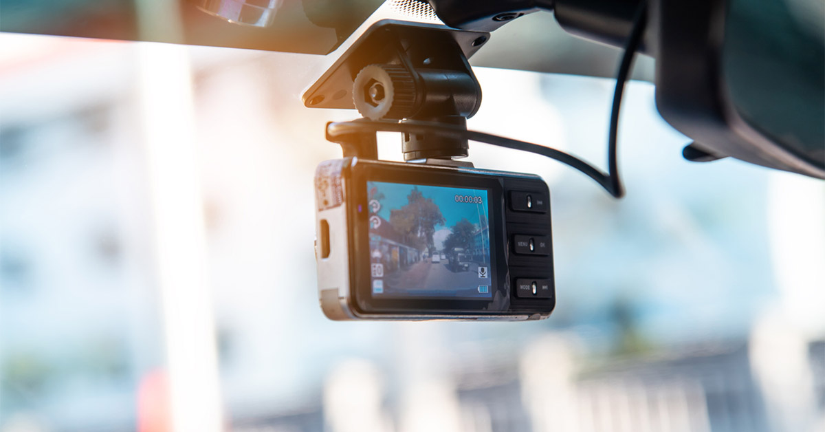 a dash cam on behind a car's windshield