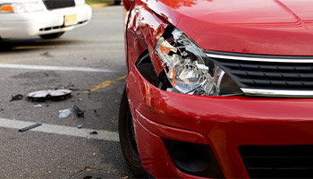 a car with front bumper damage due to 