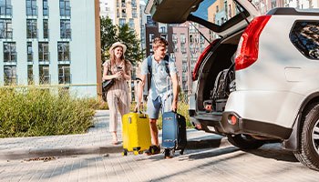 young couple renting a car