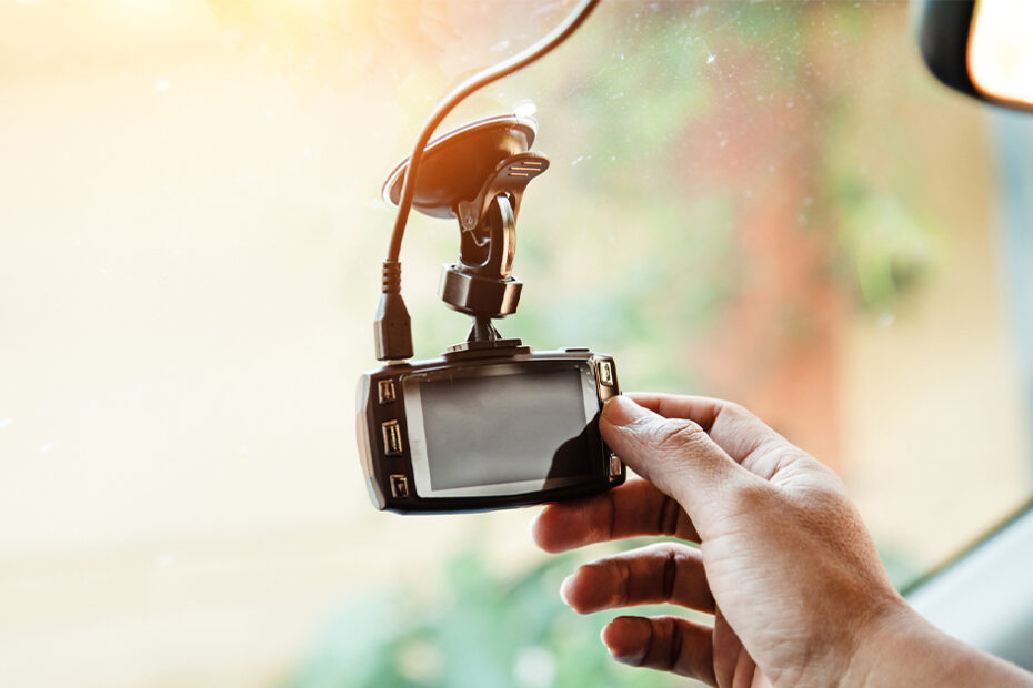 person installing a dash cam