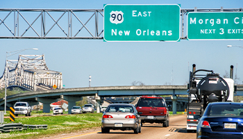 Highway 90 sign and traffic in Louisiana