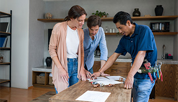 couple reviewing home renovation plans