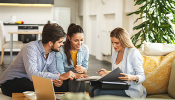 couple meeting with home insurance agent