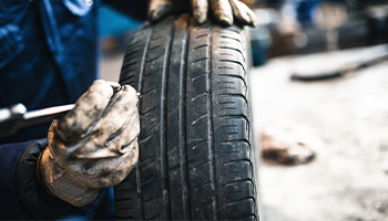 car parts examining tire