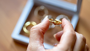 person holding up their rings