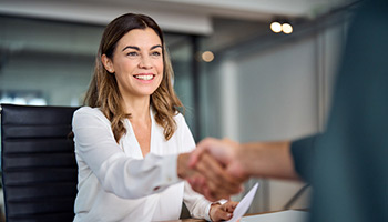 shaking hands for approved business loan