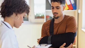 Person talking to doctor after car accident