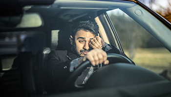 person facing driving fatigue