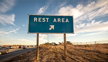 sign of a rest stop on highway