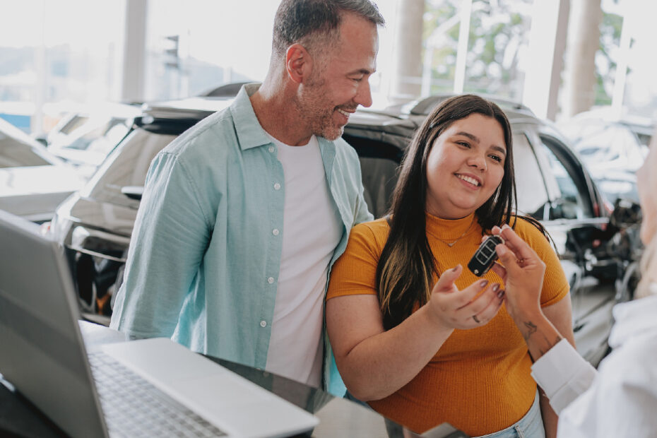 father and daughter buying a new car