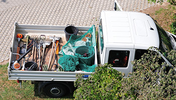 landscaper truck with tools in the truck bed